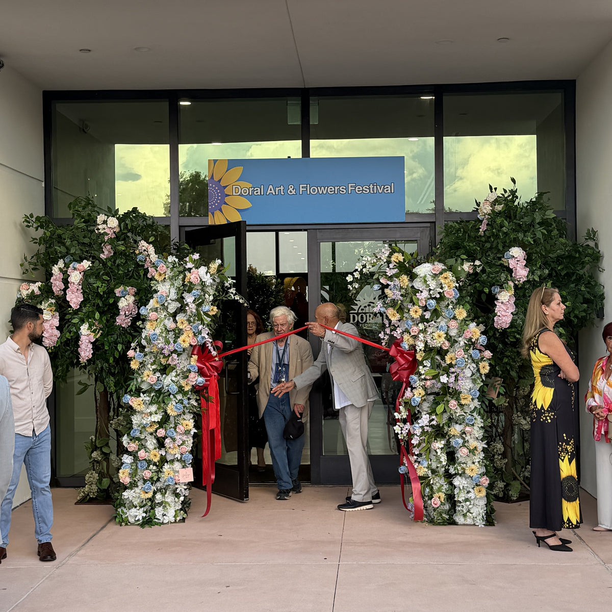 Floral archway installation created with high-end artificial flowers at a luxury event